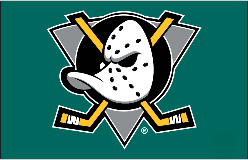 Mighty Ducks of Anaheim Primary Dark Logo (1993/94-2005/06) - When used on a dark background, as it is shown here on jade green, the original Mighty Ducks of Anaheim logo featured a duck-billed goalie mask on a grey (not jade) triangle, black circle, and two crossed hockey sticks. The Mighty Ducks used this logo from 1993 through 2006 when the team's name was shortened to just Ducks. SportsLogos.Net