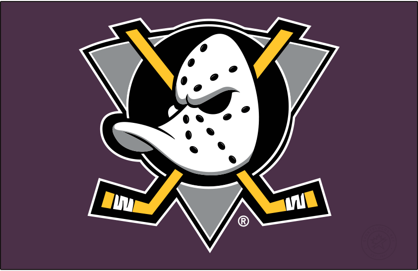 Mighty Ducks of Anaheim Logo Primary Dark Logo (1993/94-1998/99) - When used on a dark background, as it is shown here on purple, the original Mighty Ducks of Anaheim logo featured a duck-billed goalie mask on a grey (not jade) triangle, black circle, and two crossed hockey sticks. The Mighty Ducks used this logo from 1993 through 2006 but the shade of purple was lightened following the 1998-99 season. SportsLogos.Net Mighty Ducks of Anaheim Logo Primary Dark Logo (1993/94-1998/99) - When used on a dark background, as it is shown here on purple, the original Mighty Ducks of Anaheim logo featured a duck-billed goalie mask on a grey (not jade) triangle, black circle, and two crossed hockey sticks. The Mighty Ducks used this logo from 1993 through 2006 but the shade of purple was lightened following the 1998-99 season. SportsLogos.Net