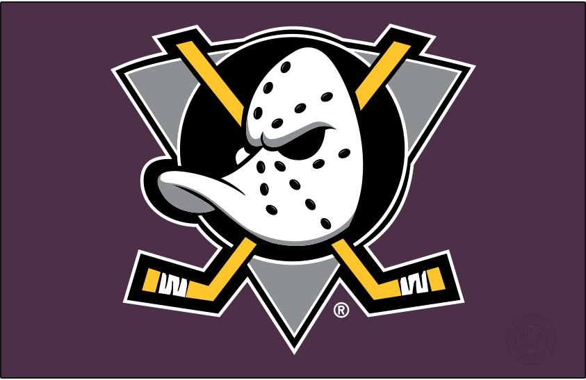 Mighty Ducks of Anaheim Logo Primary Dark Logo (1993/94-1998/99) - When used on a dark background, as it is shown here on purple, the original Mighty Ducks of Anaheim logo featured a duck-billed goalie mask on a grey (not jade) triangle, black circle, and two crossed hockey sticks. The Mighty Ducks used this logo from 1993 through 2006 but the shade of purple was lightened following the 1998-99 season. SportsLogos.Net