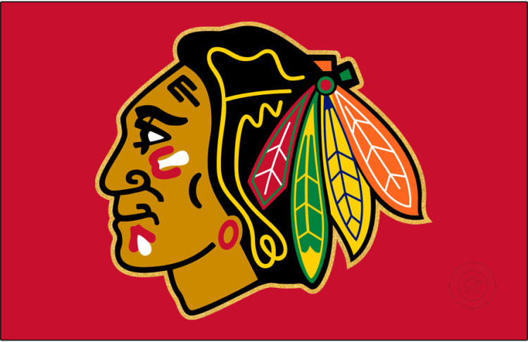 Chicago Blackhawks Logo Jersey Logo (2025/26) - The Chicago Blackhawks' home jersey logo used during the 2025-26 season only added a new metallic-gold outline to the outside of their familiar Native American head logo. This gold line was added in recognition of the club's centennial season and was added to their home red sweater only. SportsLogos.Net