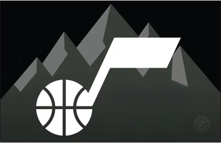 Utah Jazz Logo Jersey Logo (2024/25-Pres) - The Utah Jazz Statement jersey logo features the club's jazz note basketball logo in black with a black and grey mountain range design behind it, worn across the chest of a black jersey. SportsLogos.Net